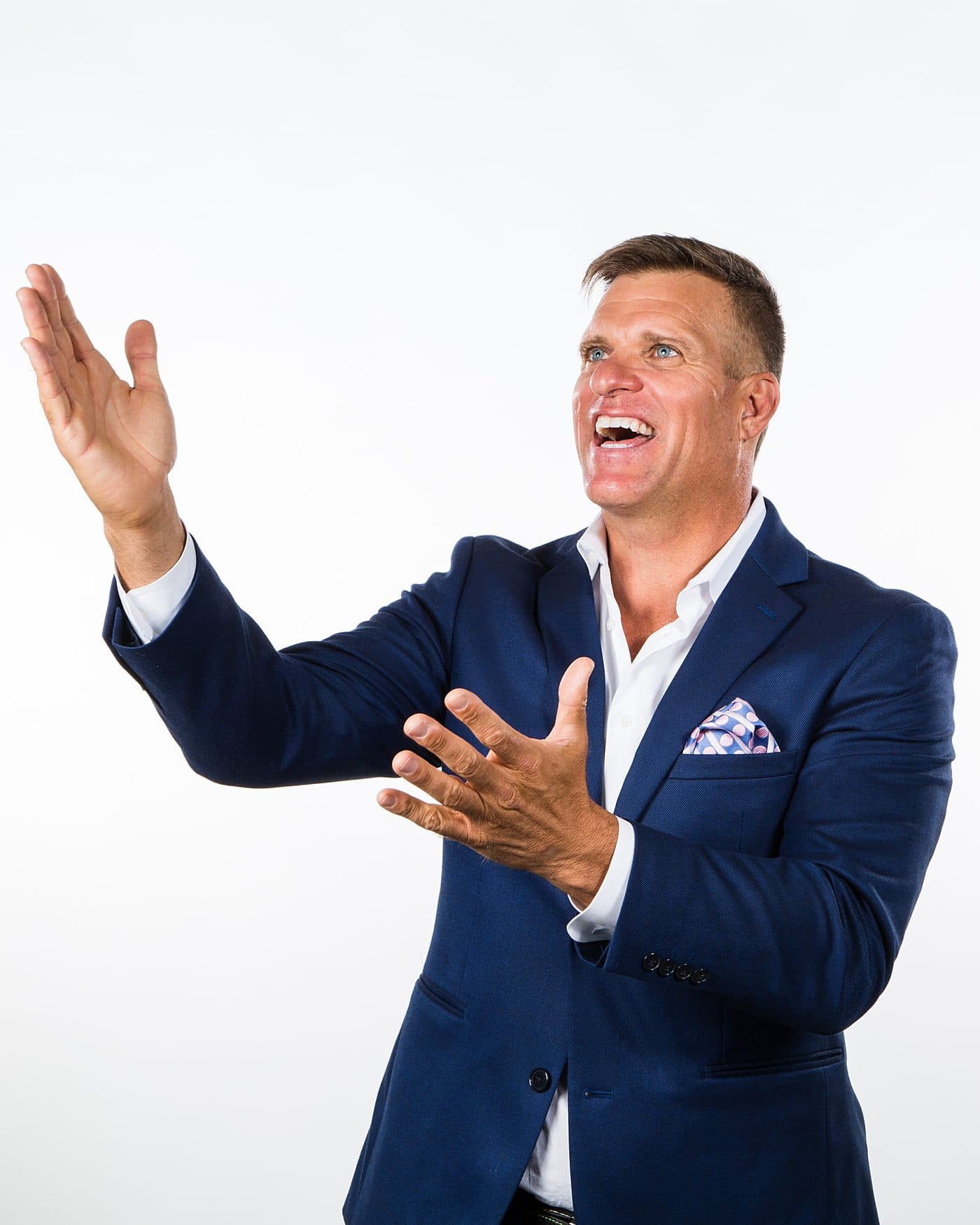 Dave VanHoose mid-presentation with both hands raised